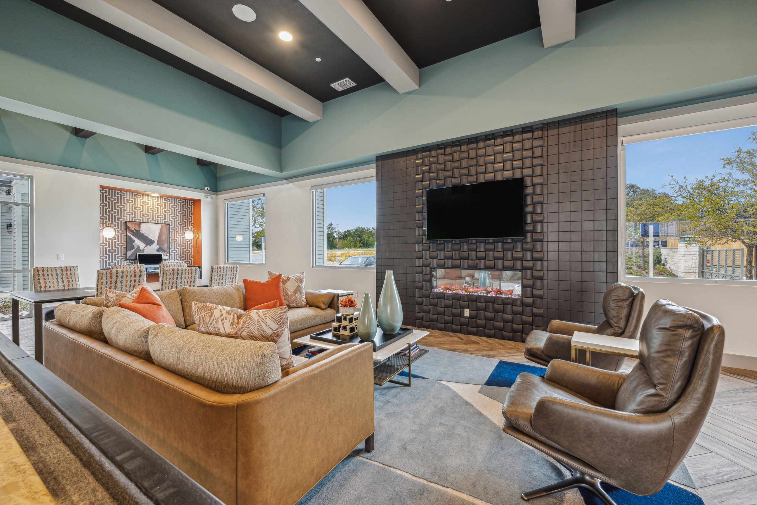 Large Couch, fireplace, business center in the clubhouse