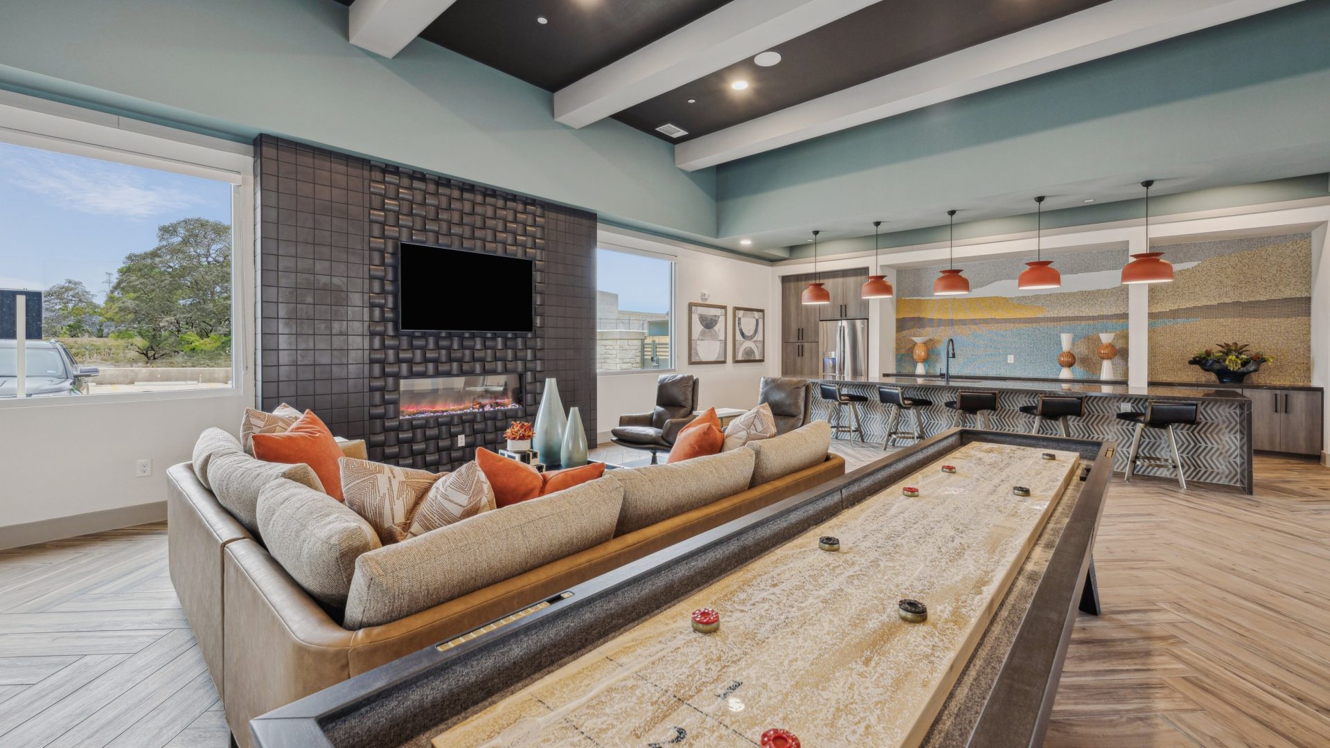 a large living room with a pool table and couches at The Legacy at Veramendi